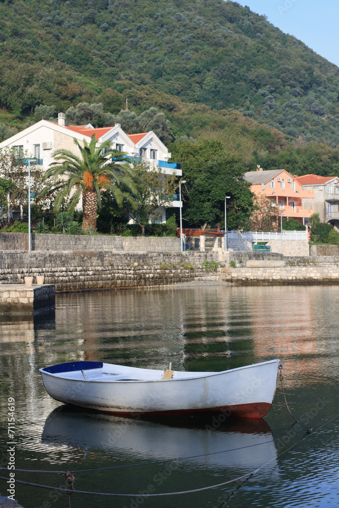 Fototapeta premium White fishing boat near the village Stoliv in Montenegro.