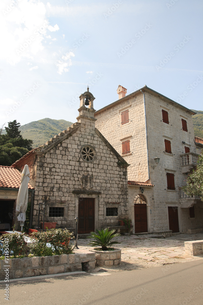 The Catholic Church and the house in a village in Montenegro