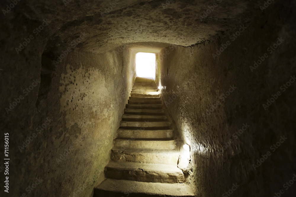 stone narrow passage with stairs leading