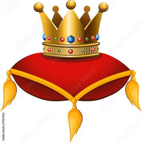 Gold crown on a crimson cushion photo