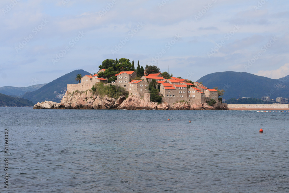 island of Sveti Stefan mountains in the background.