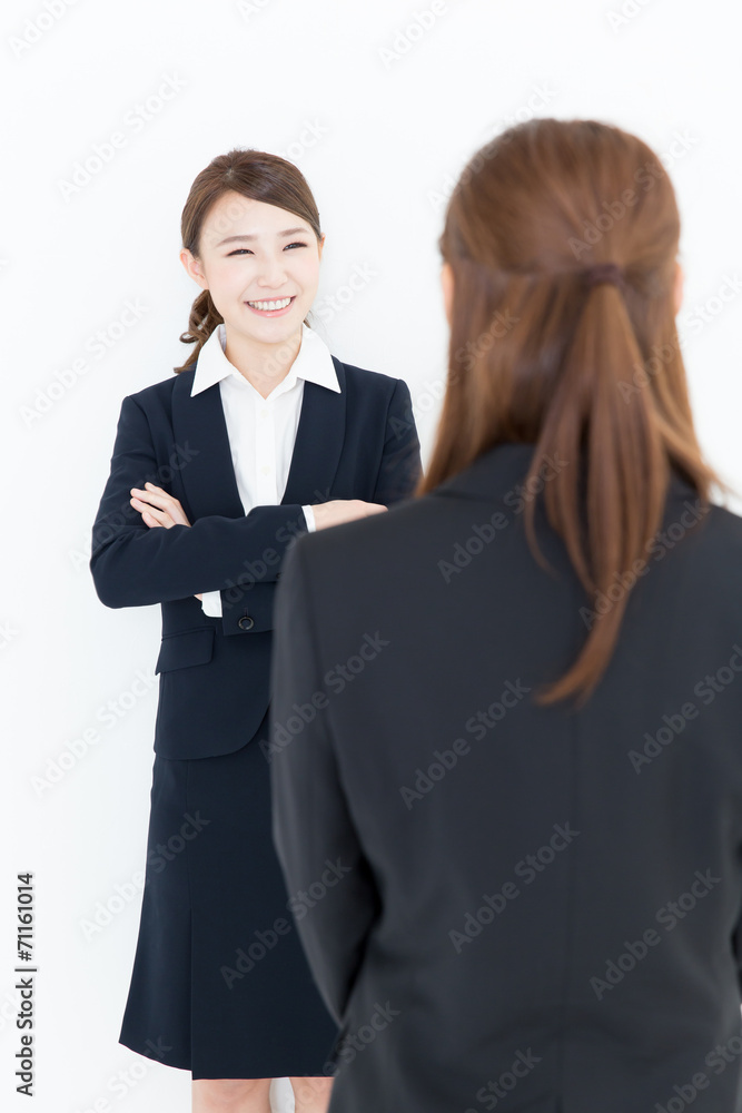 asian businesswomen talking on white background asian businesswomen talking on white background