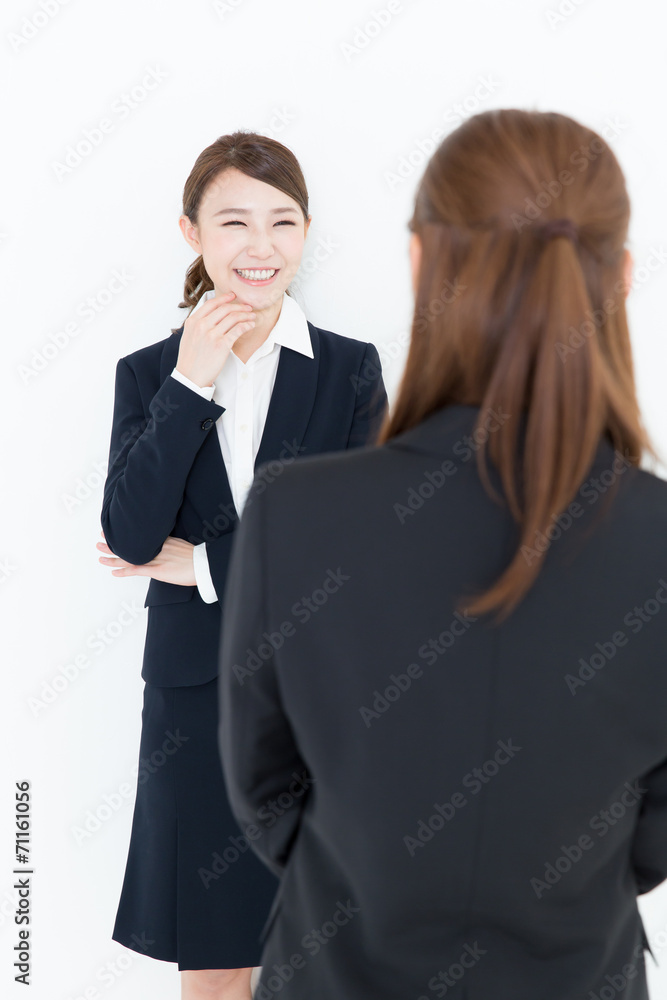 asian businesswomen talking on white background asian businesswomen talking on white background
