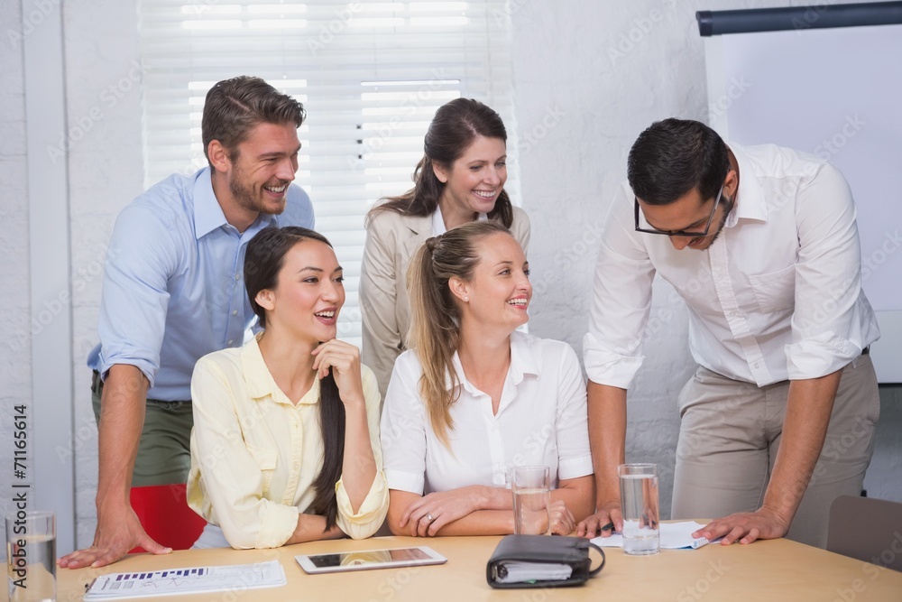 Happy business people working together on a document