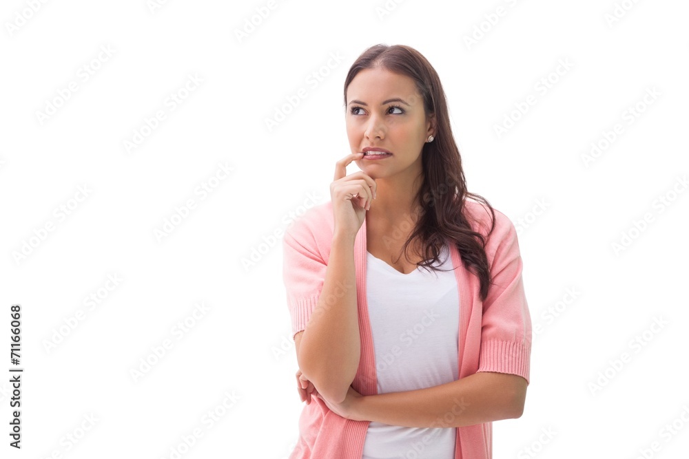 Pretty brunette thinking with finger to mouth Pretty brunette thinking with finger to mouth