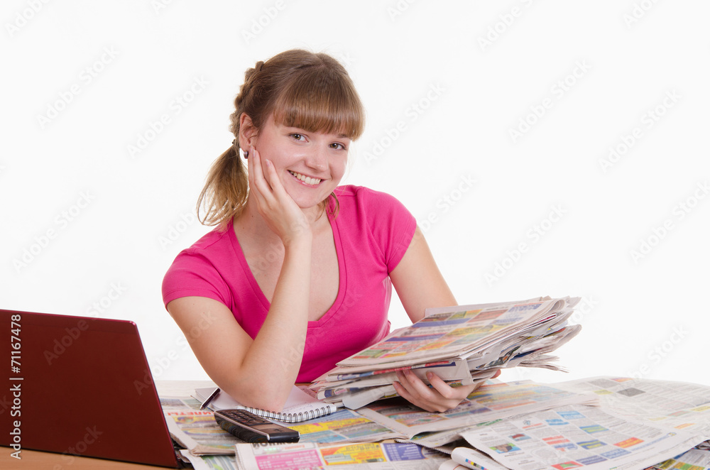 Happy girl with a stack of newspapers Happy girl with a stack of newspapers