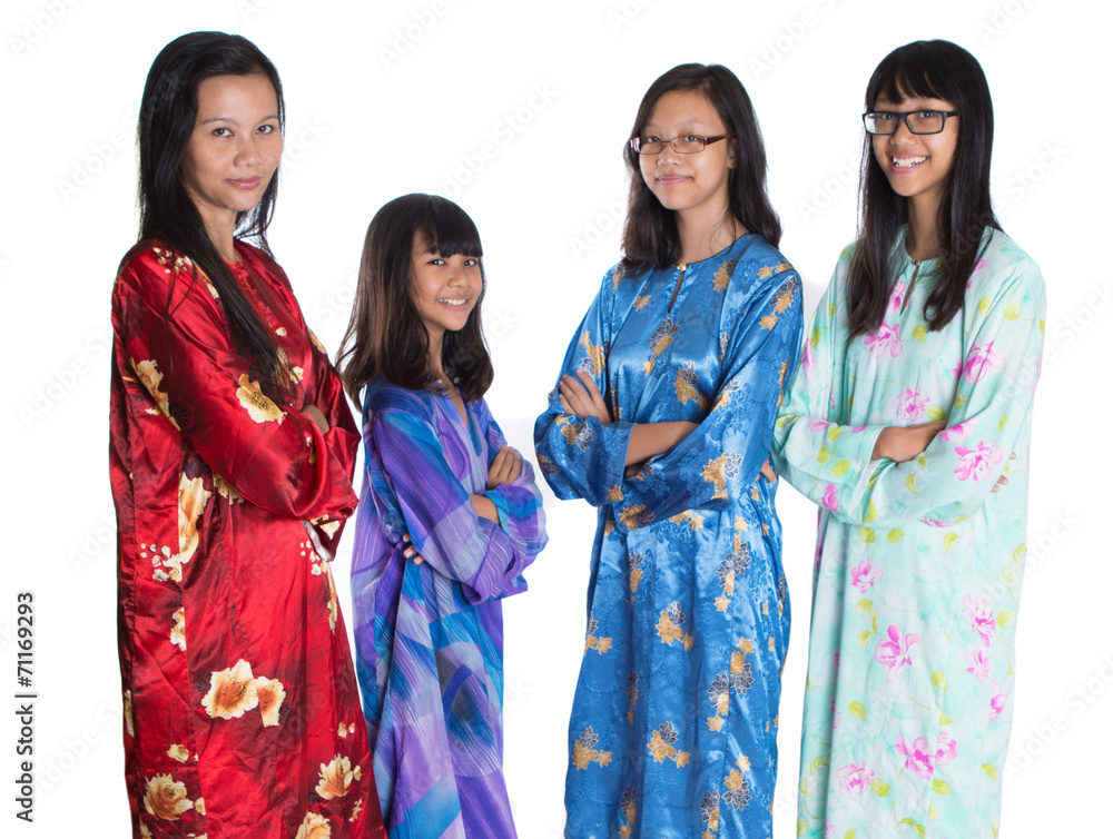 Asian Malay mother and daughters in traditional dress Asian Malay mother and daughters in traditional dress