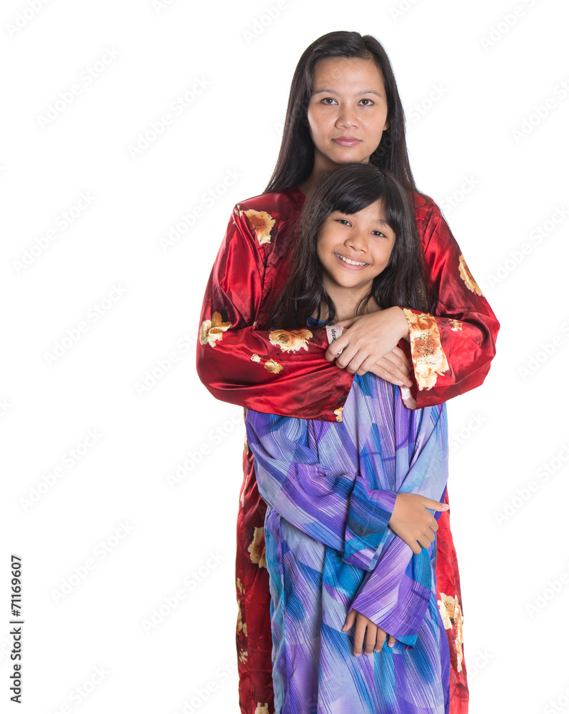 Asian Malay mother and daughter in traditional dress Asian Malay mother and daughter in traditional dress