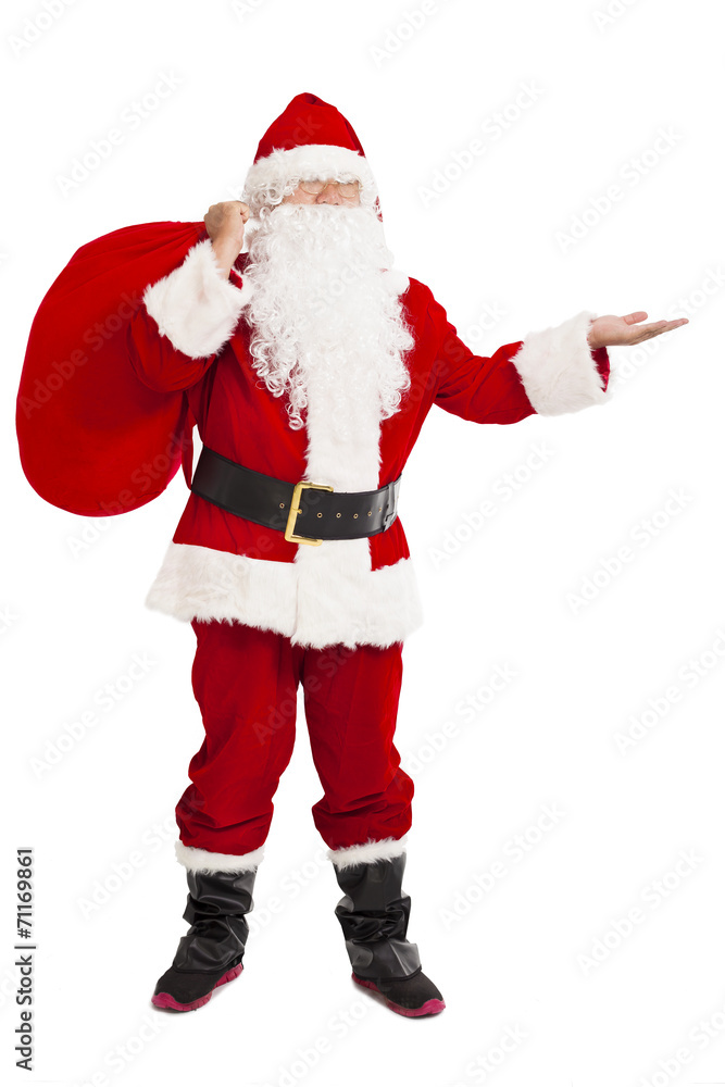 merry Christmas Santa Claus holding gift bag and showing merry Christmas Santa Claus holding gift bag and showing