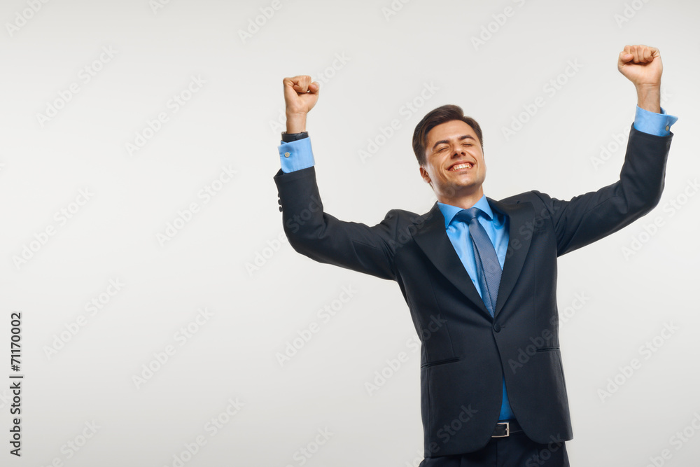 Business Man Celebrating Success against White Background Business Man Celebrating Success against White Background