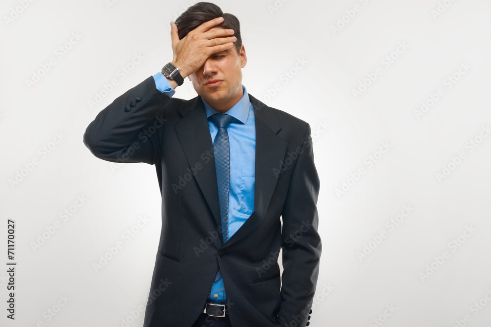 Naklejka premium Stressed Businessman against white background