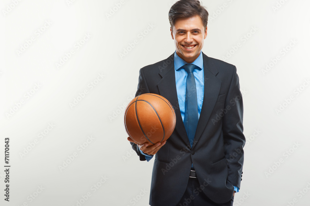 Happy Businessman with  ball against white background