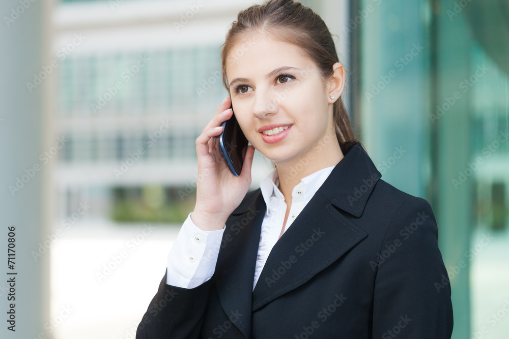 Beautiful young woman talking on the phone Beautiful young woman talking on the phone