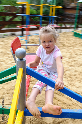 Active little girl on playground