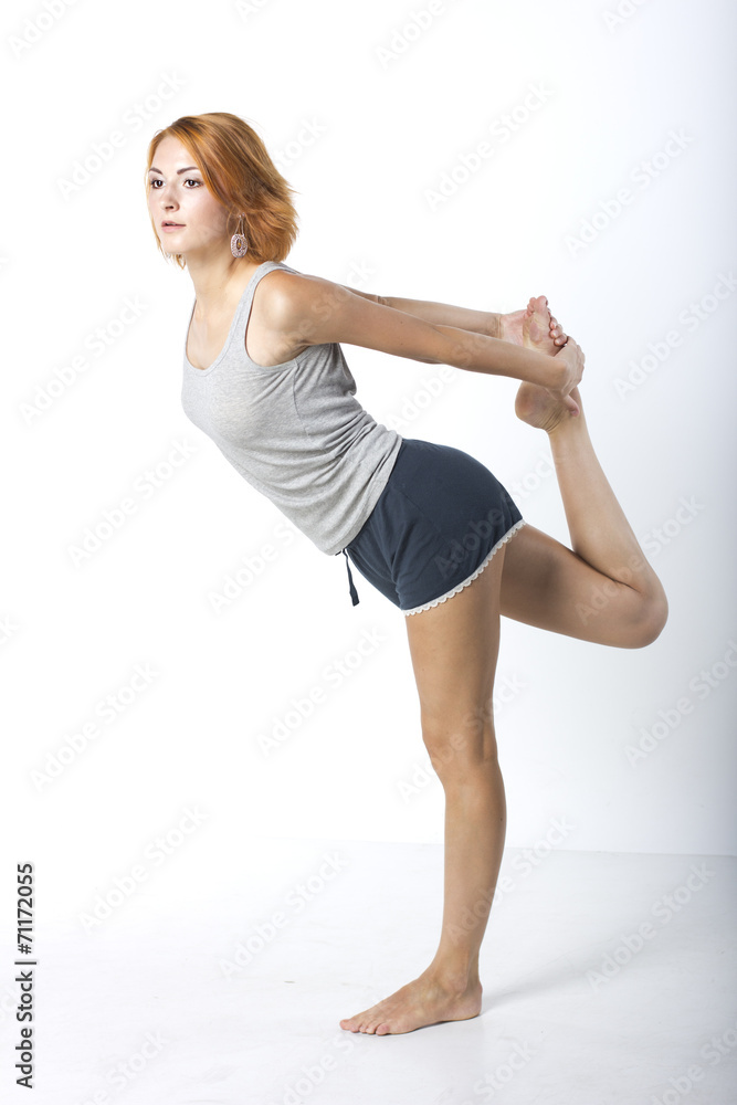 Young slim girl doing exercises