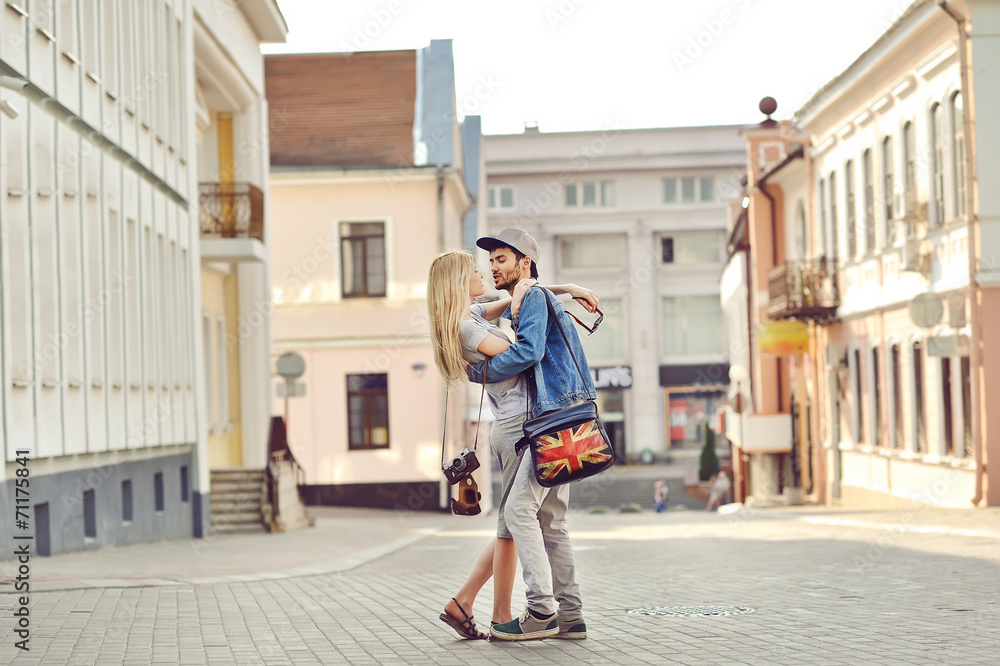 Young couple in love outdoor. Sensual outdoor portrait of young