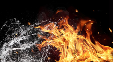 Fire and water elements on black background