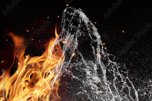 Fire and water elements on black background