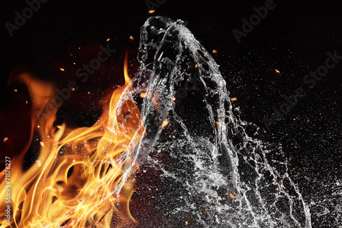 Fire and water elements on black background photo