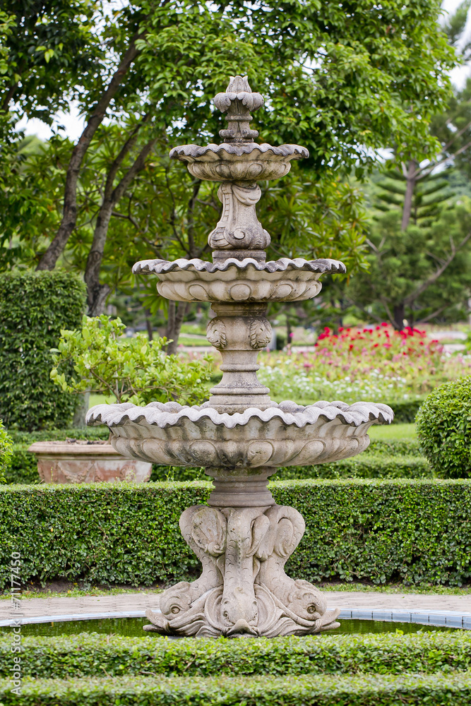 A large fountain outside with Thai style Sculpture