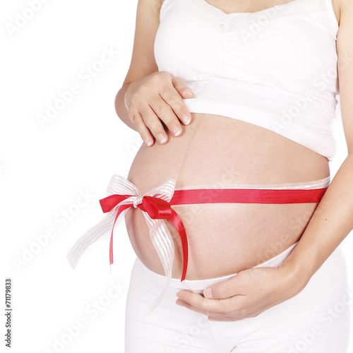 Wallpaper Mural Belly of a pregnant woman with red and white ribbon Torontodigital.ca
