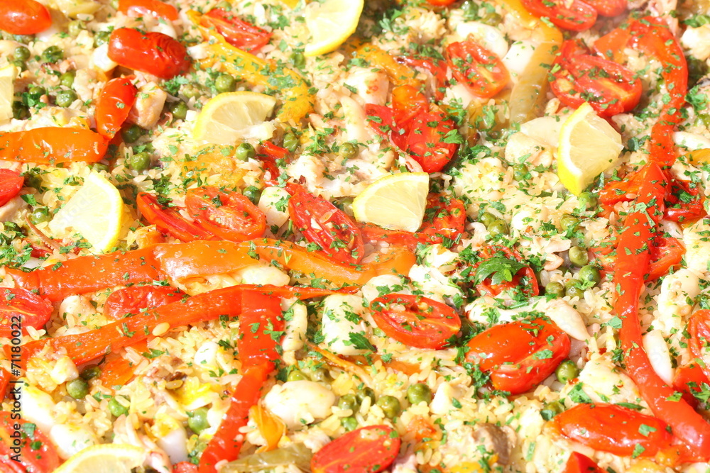 background of Valencian paella with rice and tomato background of Valencian paella with rice and tomato