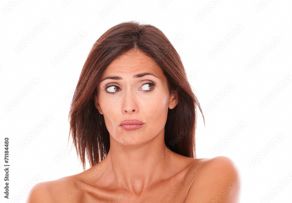 Unsmiling latin woman looking to her left Unsmiling latin woman looking to her left