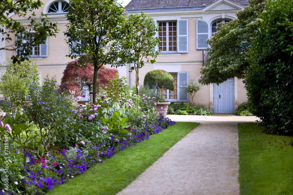 House in a beautiful garden in spring House in a beautiful garden in spring