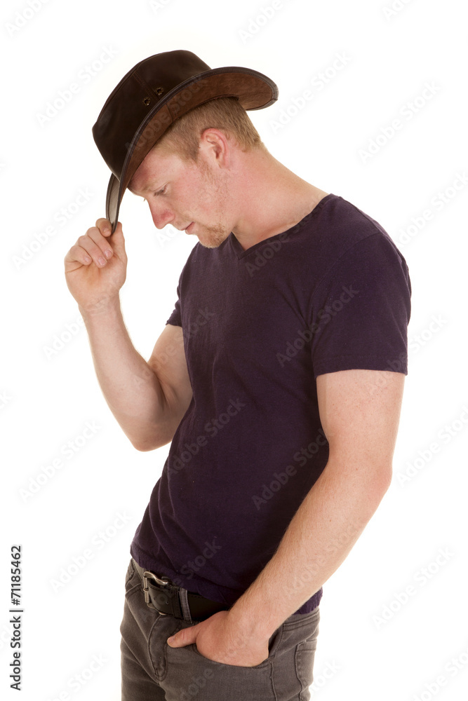 man in purple shirt cowboy hat side look down man in purple shirt cowboy hat side look down