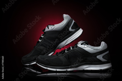 Sport shoes, running accessory. Isolates Black Background Red Sp