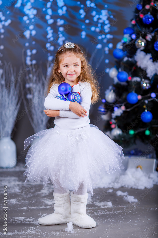 little girl in suit Snow Maiden near the Christmas tree little girl in suit Snow Maiden near the Christmas tree