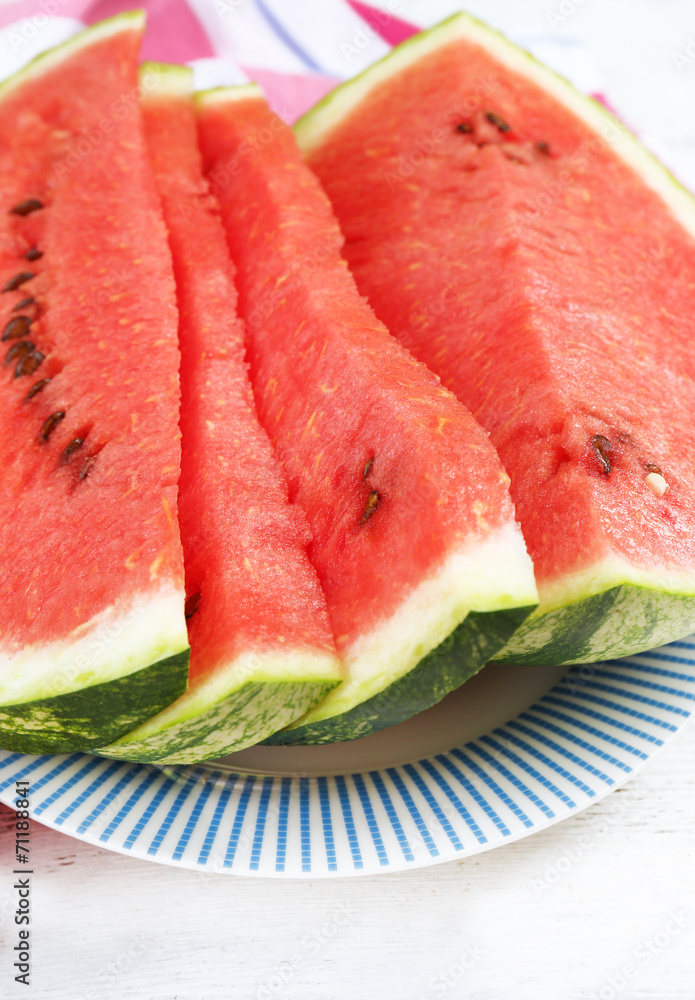 Fresh slice of watermelon on table outdoors, close up Fresh slice of watermelon on table outdoors, close up