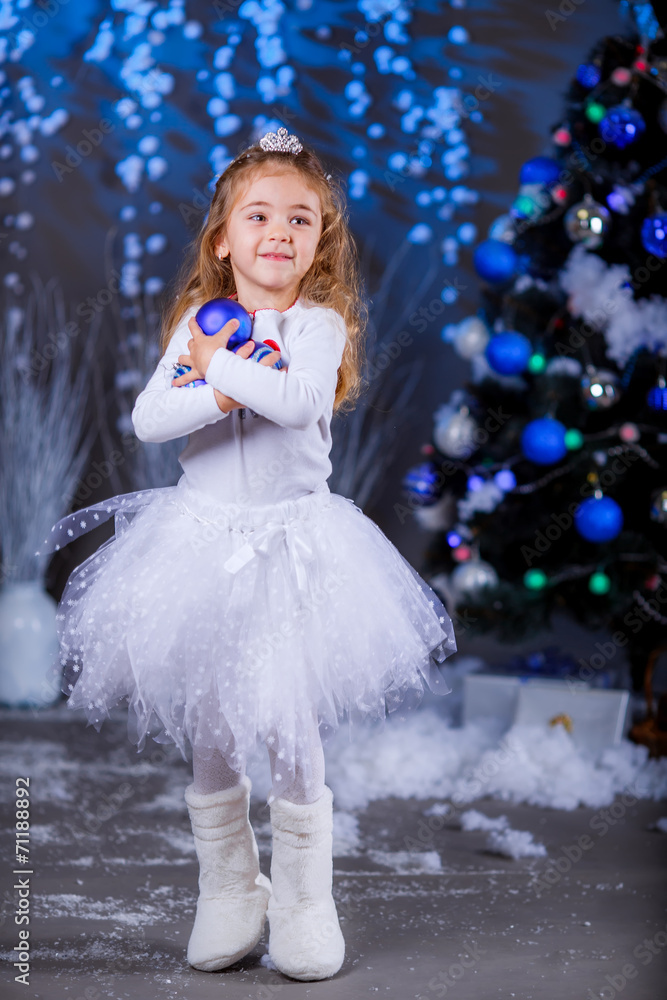 little girl in suit Snow Maiden near the Christmas tree little girl in suit Snow Maiden near the Christmas tree