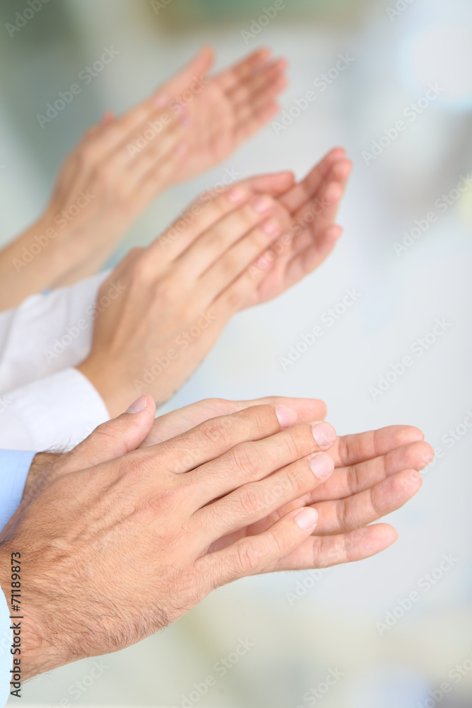 Obraz premium Clapping hands on bright background