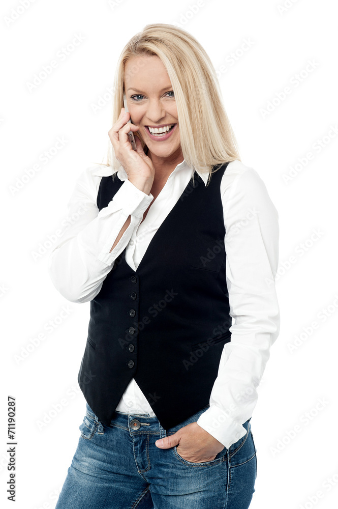 Smiling woman talking on the cell phone Smiling woman talking on the cell phone