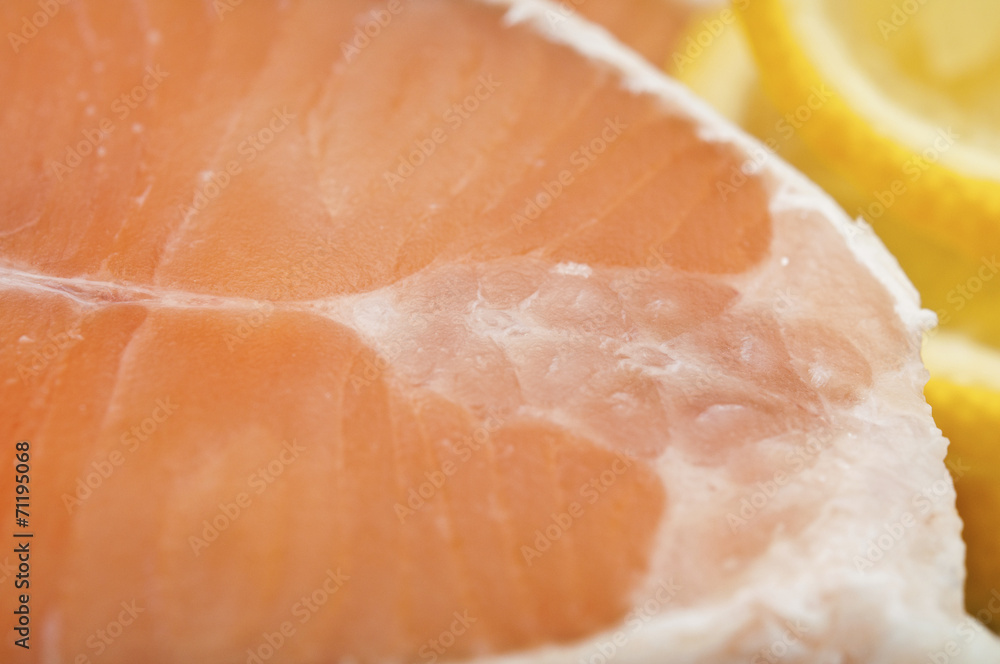 dish for baking with slices of salmon over wooden table dish for baking with slices of salmon over wooden table