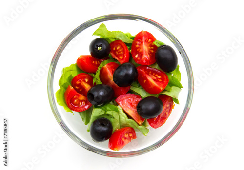 Fresh salad from above on white background