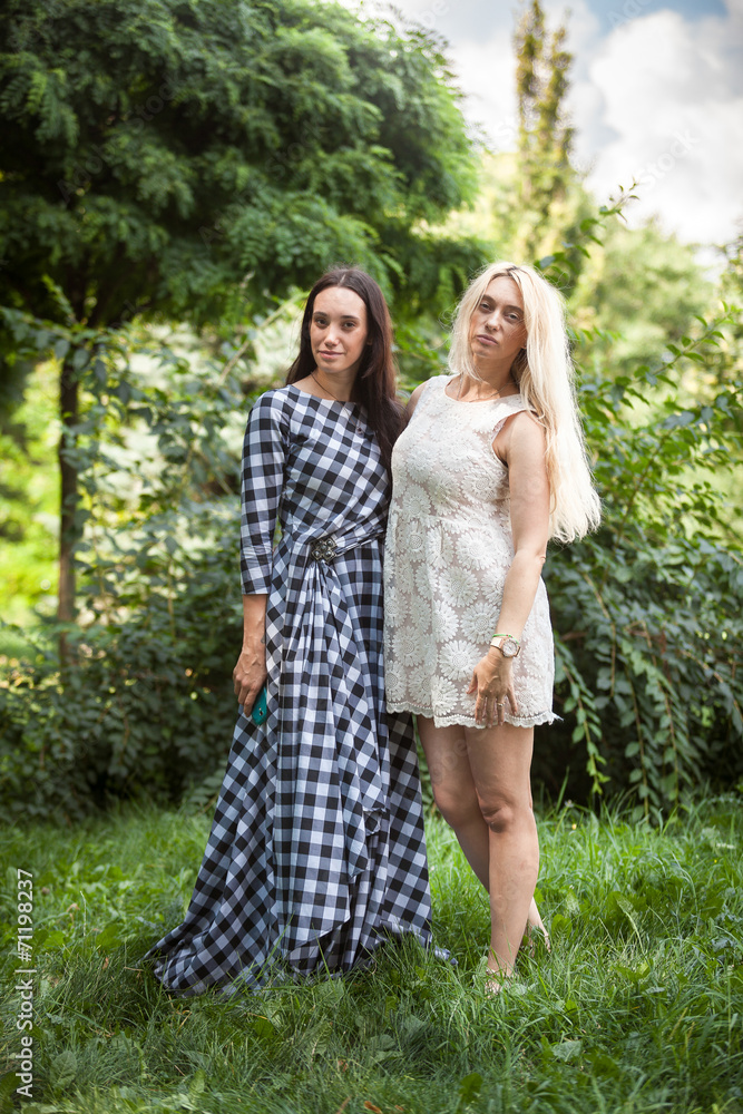 Sexy Adult Daughter And Mother Posing At Park Stock Photo Adobe Stock