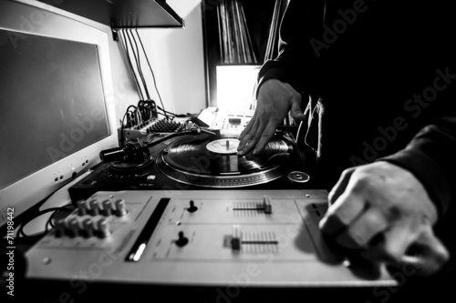 Dj in studio with turntable and mixer