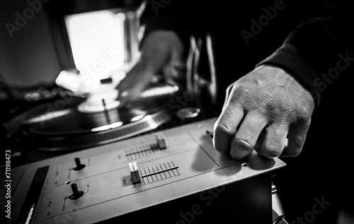 Dj in studio with turntable and mixer