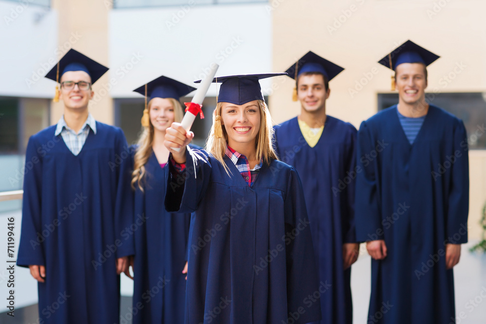group of smiling students in mortarboards group of smiling students in mortarboards