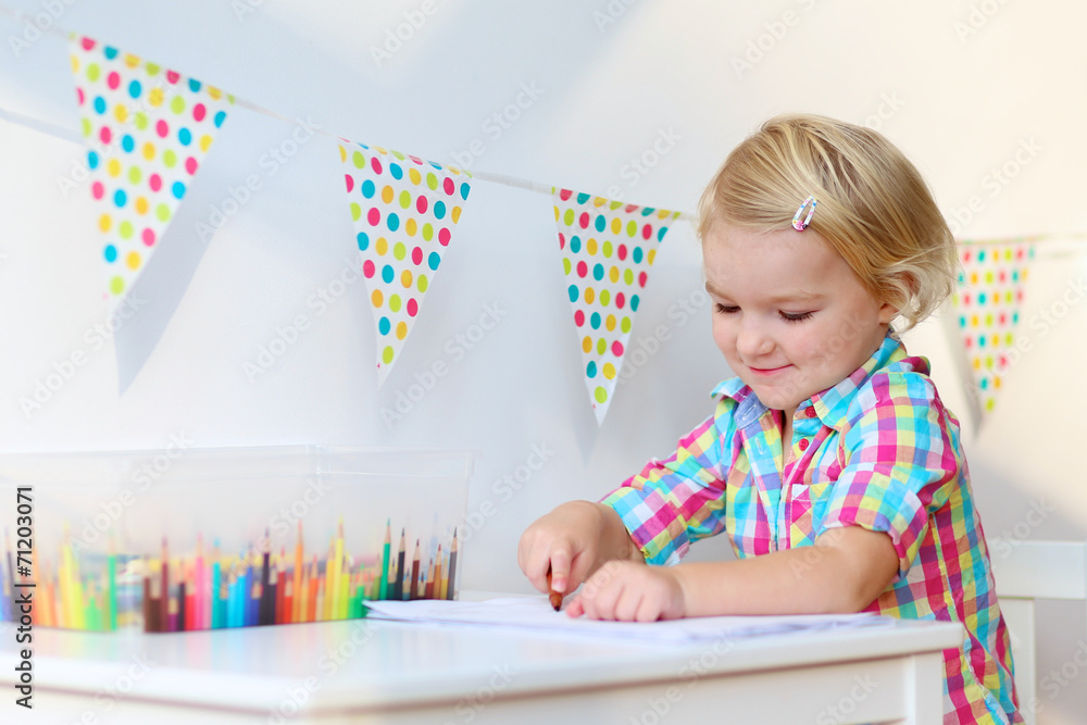 Preschool girl drawing with pencils on papers Preschool girl drawing with pencils on papers