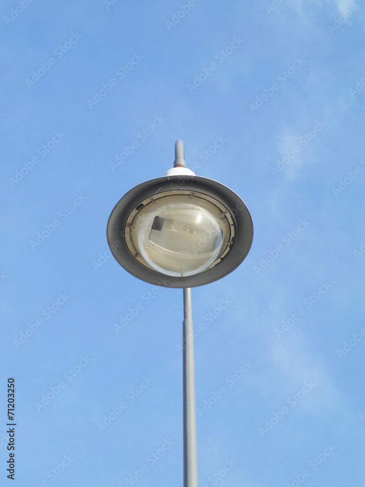 a street light pole with a blue sky background a street light pole with a blue sky background