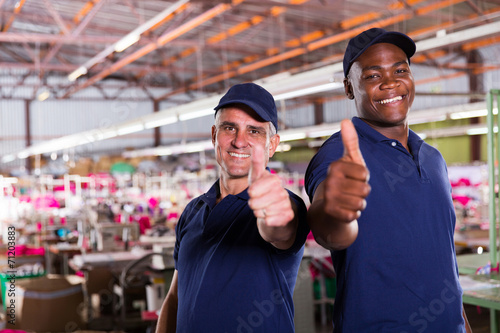 factory supervisors giving thumbs up