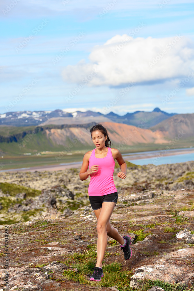 Athlete runner woman running in nature