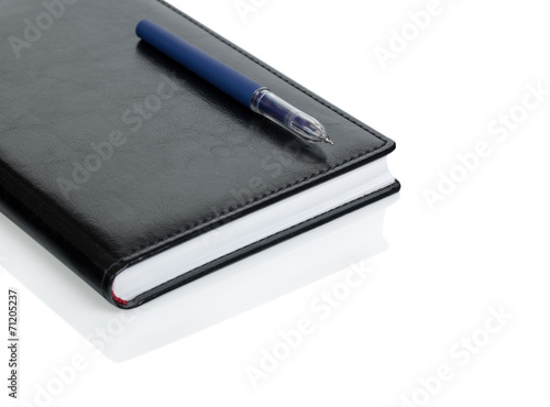 Leather notebook and pen isolated on the white