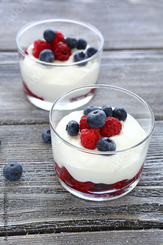 two glasses of yogurt with berries