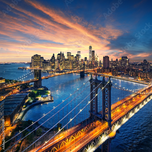 New York City - sunset over manhattan and brooklyn bridge