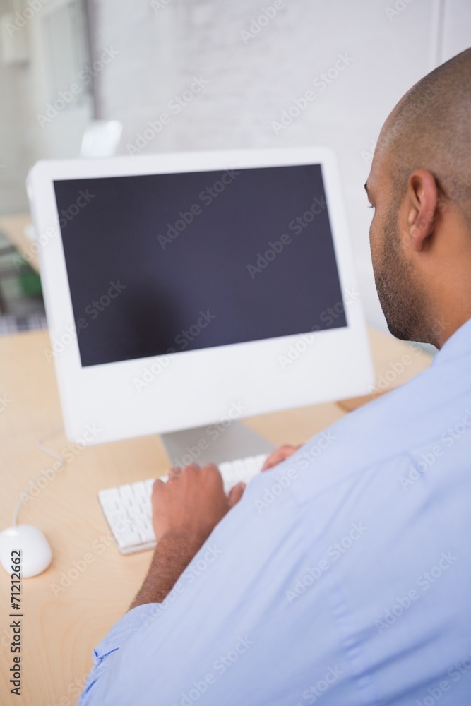 Businessman using computer at desk Businessman using computer at desk