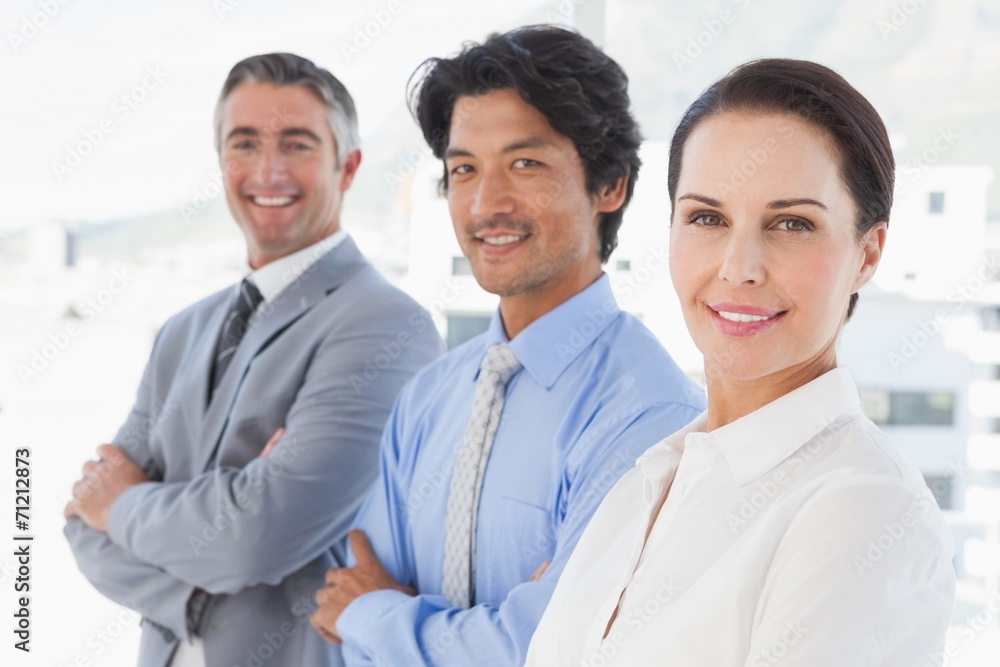 Smiling work colleagues standing together Smiling work colleagues standing together